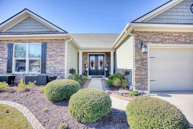 doorway to property featuring french doors and a garage