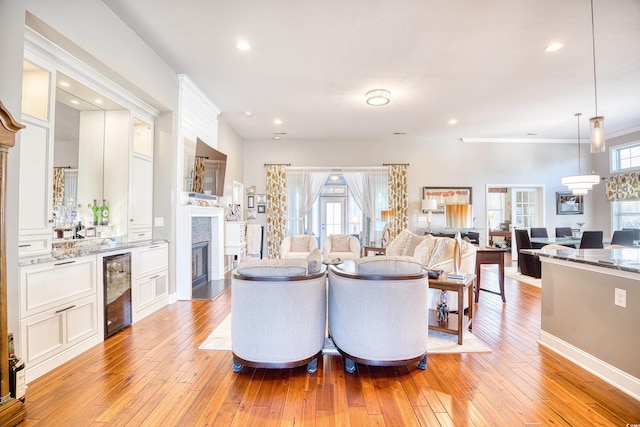 living room featuring light hardwood / wood-style flooring and beverage cooler