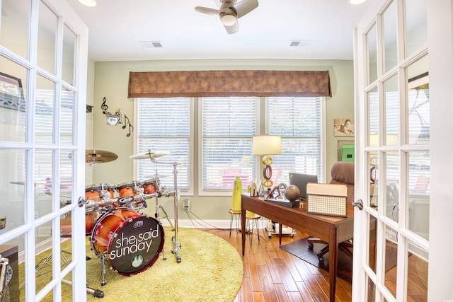 home office featuring ceiling fan, french doors, and hardwood / wood-style floors