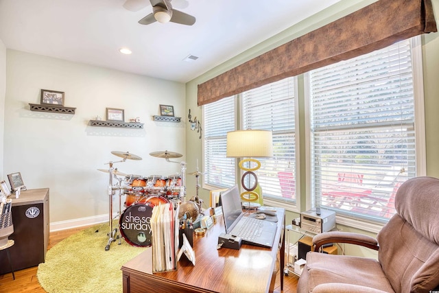 office with ceiling fan and hardwood / wood-style floors