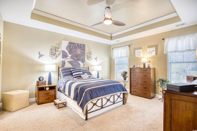 bedroom with carpet, ceiling fan, and a tray ceiling