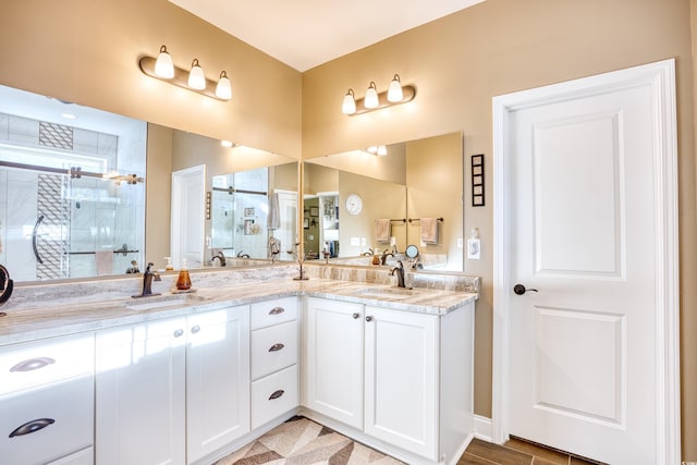 bathroom with an enclosed shower and vanity