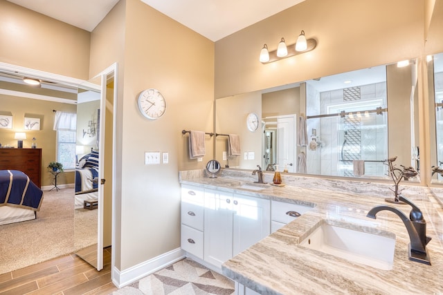 bathroom with walk in shower and vanity