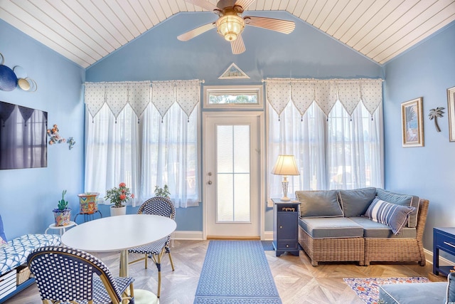 living room with lofted ceiling, ceiling fan, and light parquet floors