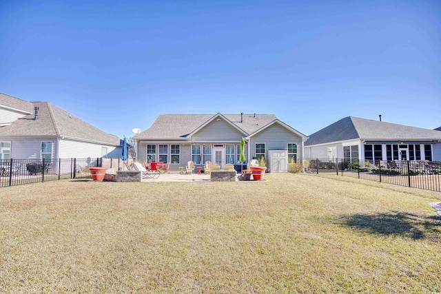 view of front of house with a fire pit, a patio area, and a front yard