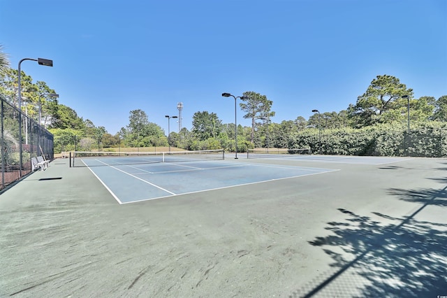 view of sport court featuring basketball hoop