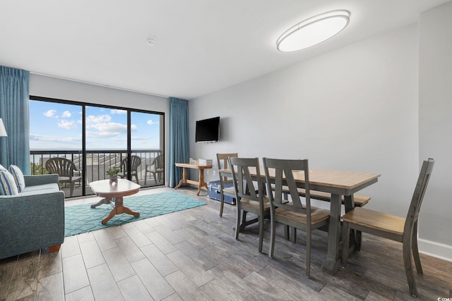 living room featuring wood-type flooring and a water view