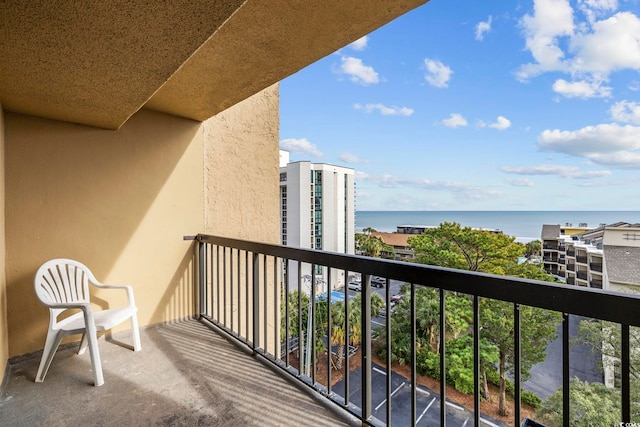 balcony featuring a water view