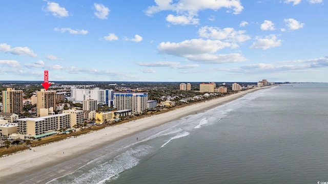 aerial view with a water view and a beach view