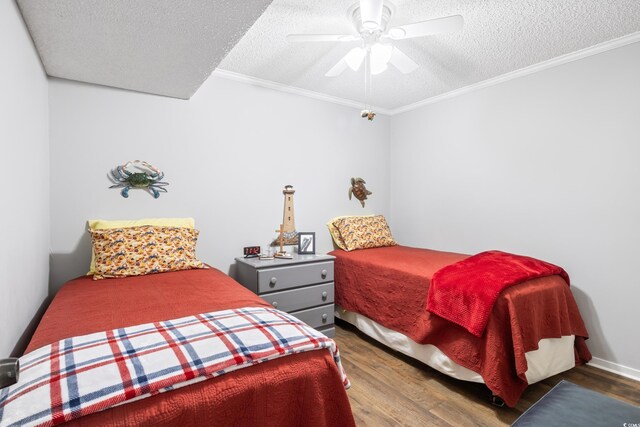 bedroom with a textured ceiling, ceiling fan, hardwood / wood-style flooring, and ornamental molding