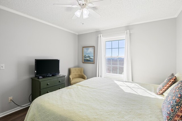 bedroom with a textured ceiling, ceiling fan, and dark hardwood / wood-style flooring