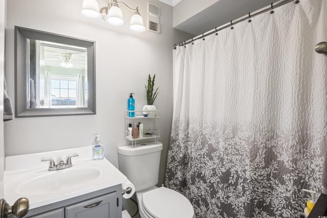 bathroom featuring ceiling fan, vanity, and toilet