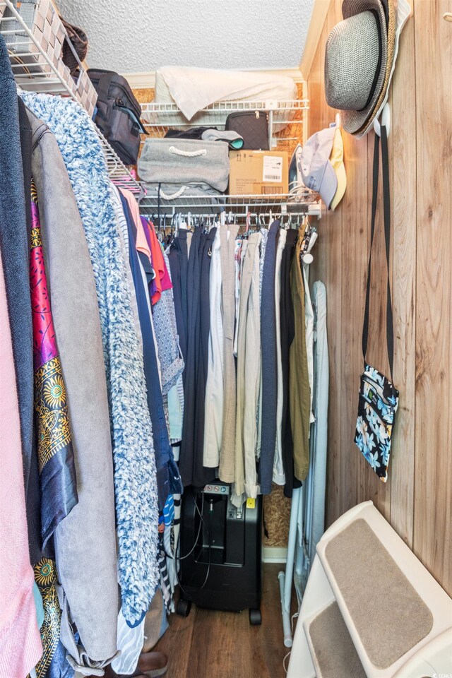 walk in closet featuring dark hardwood / wood-style flooring