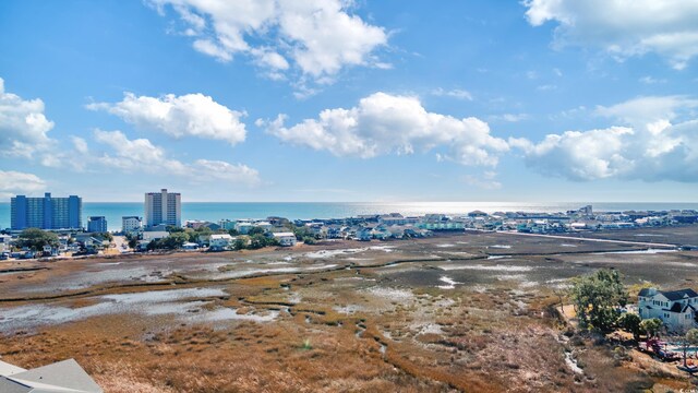 bird's eye view featuring a beach view and a water view