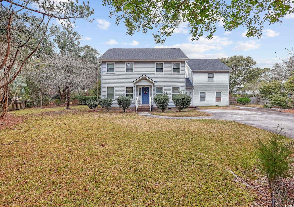 colonial inspired home with a front yard