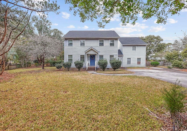 colonial inspired home with a front yard