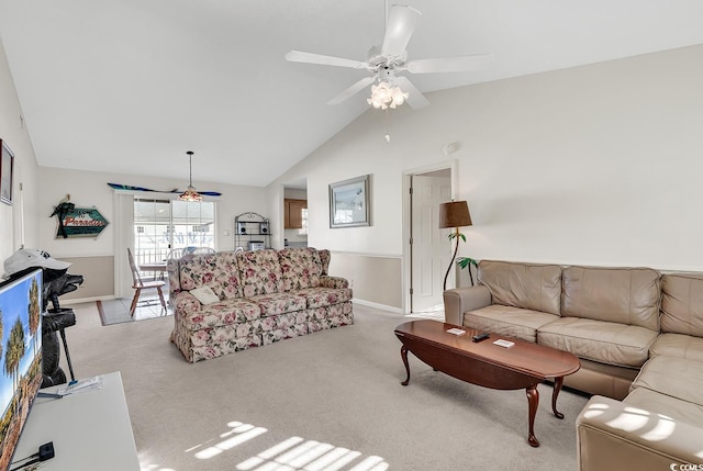 carpeted living room with ceiling fan and lofted ceiling