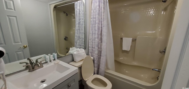 full bathroom featuring shower / bathtub combination with curtain, vanity, and toilet