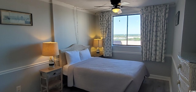 bedroom featuring hardwood / wood-style floors and ceiling fan