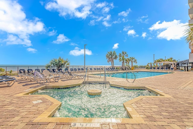 view of swimming pool with a patio area