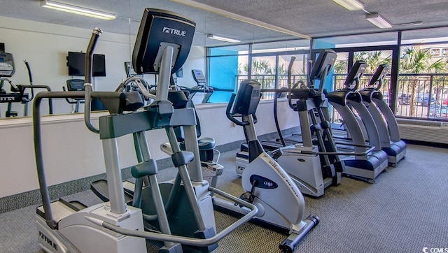 workout area featuring a textured ceiling