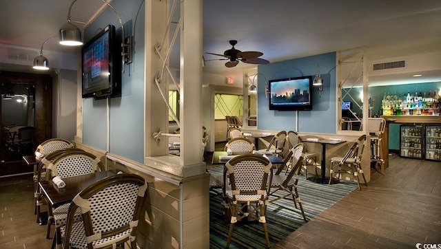 interior space featuring ceiling fan and hardwood / wood-style flooring