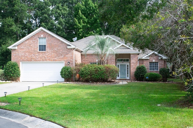 view of front facade with a garage, driveway, brick siding, and a front lawn