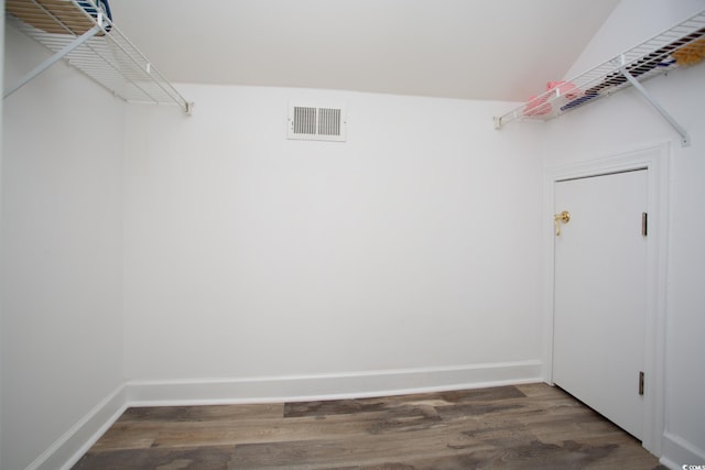 walk in closet with wood finished floors and visible vents