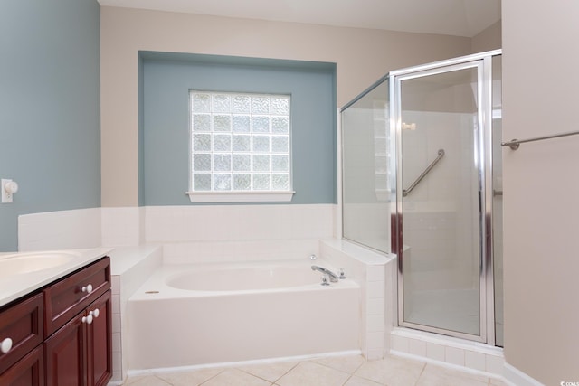 full bath with tile patterned flooring, a garden tub, vanity, and a stall shower