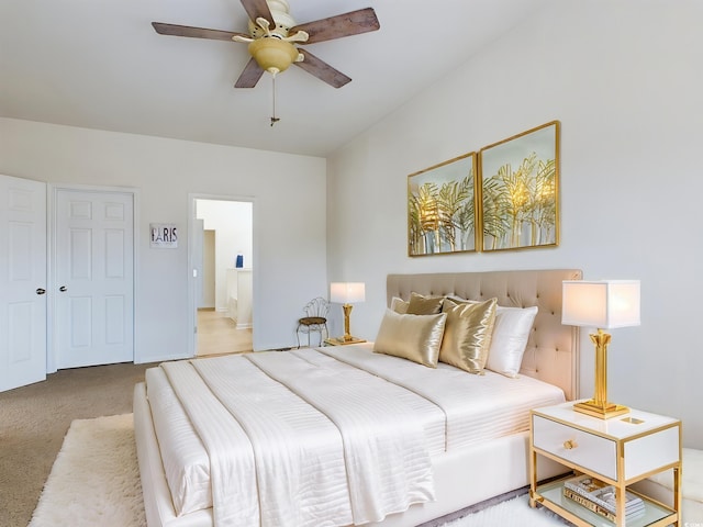 carpeted bedroom with ceiling fan and connected bathroom