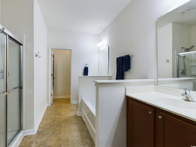 bathroom with separate shower and tub and vanity