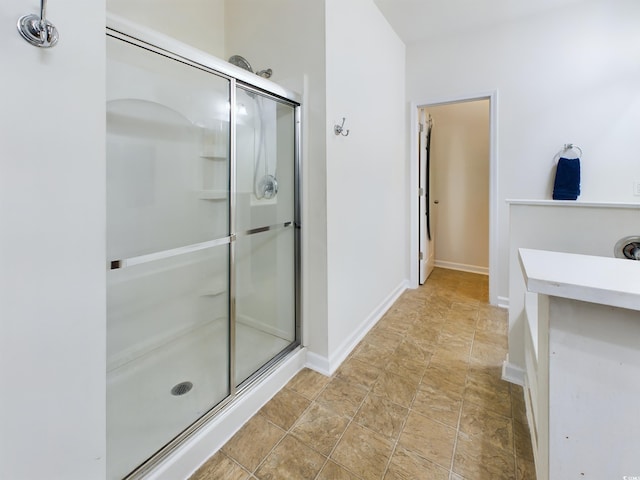 bathroom with a shower with shower door