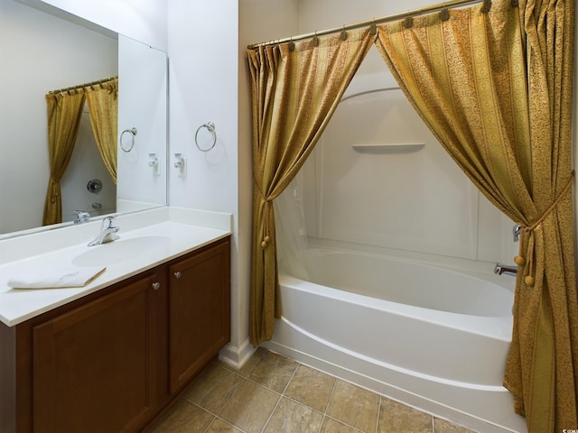 bathroom featuring shower / tub combo and vanity