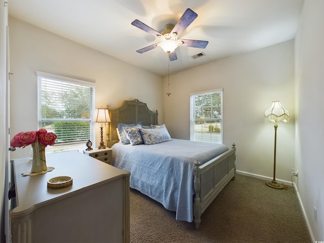 bedroom featuring carpet flooring, baseboards, visible vents, and ceiling fan