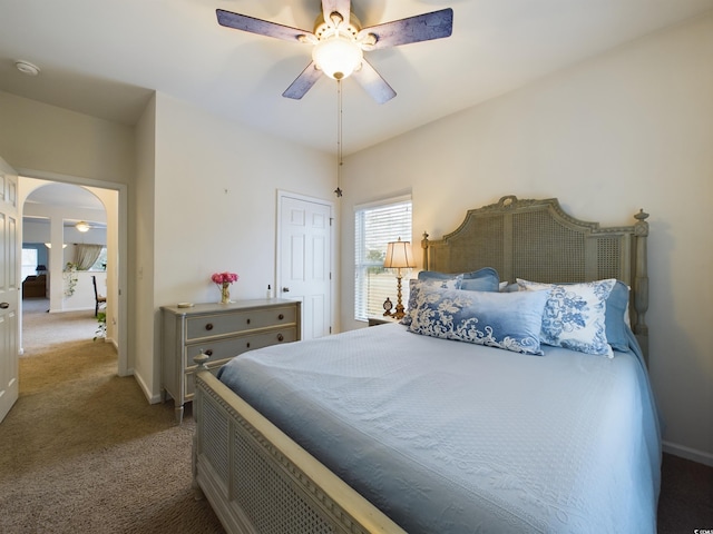 carpeted bedroom with ceiling fan