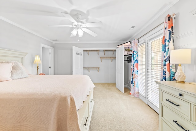 bedroom with a closet, ceiling fan, ornamental molding, and light colored carpet