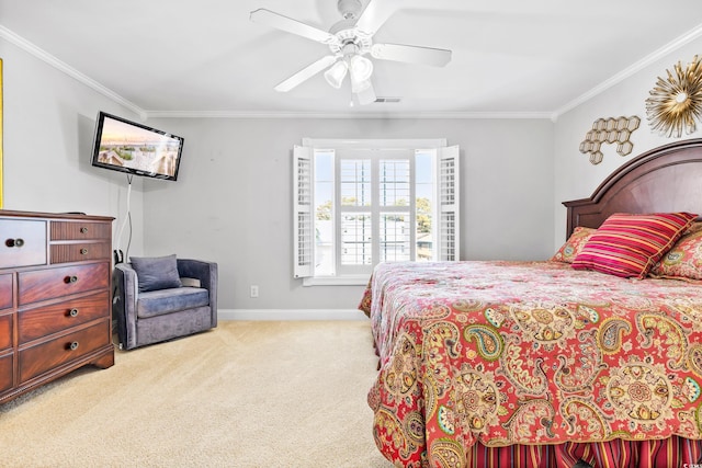 carpeted bedroom featuring ceiling fan and ornamental molding