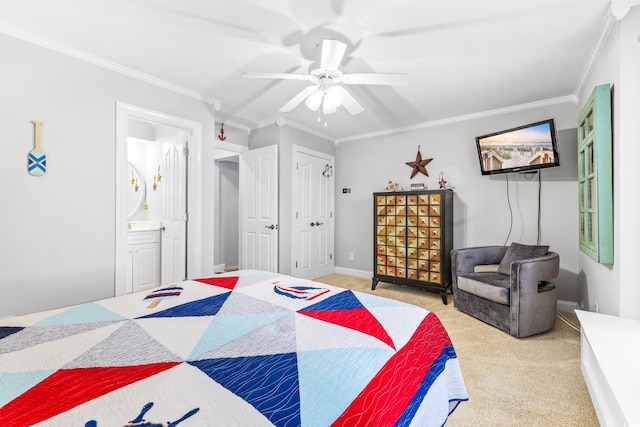 carpeted bedroom with ensuite bathroom, ceiling fan, and ornamental molding