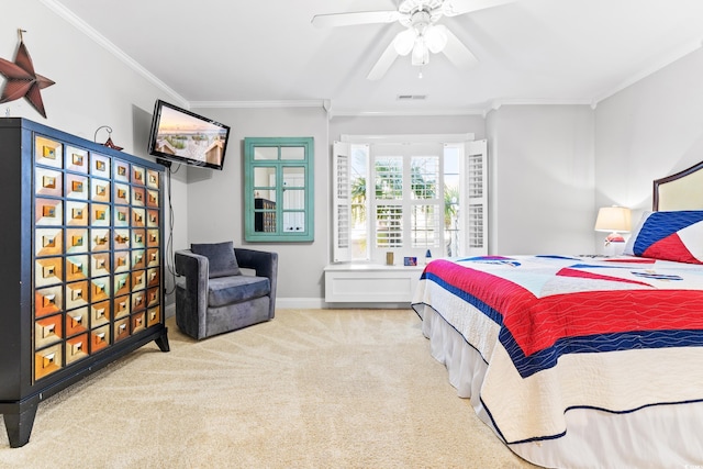 carpeted bedroom featuring ceiling fan and ornamental molding