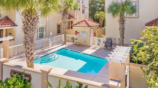 view of pool featuring a patio