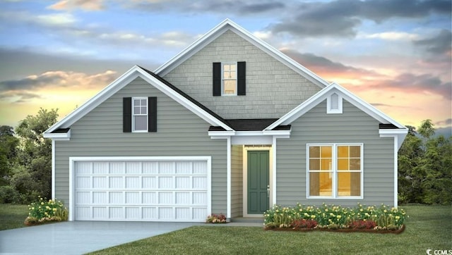 view of front facade featuring a garage and a lawn