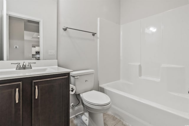 full bathroom featuring toilet, vanity, tile patterned flooring, and  shower combination