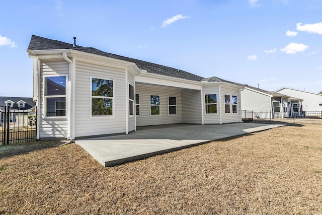 rear view of house featuring a patio