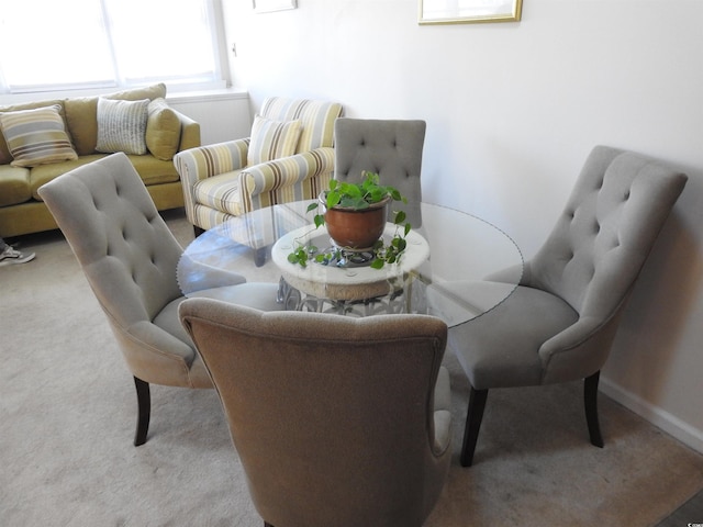 dining area with light carpet