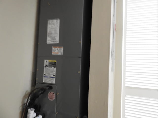 utility room featuring heating unit