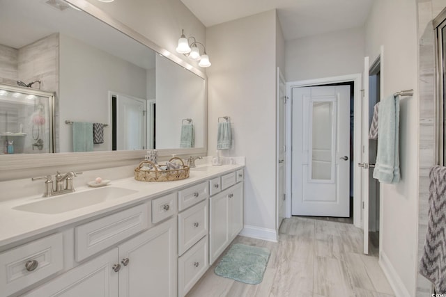 bathroom with an enclosed shower and vanity