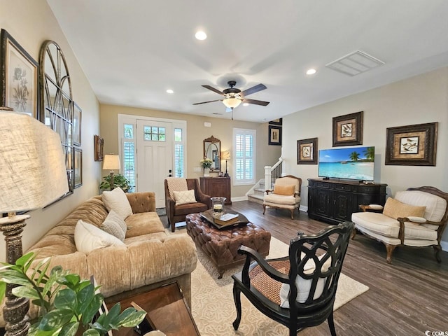 living room with ceiling fan and wood-type flooring