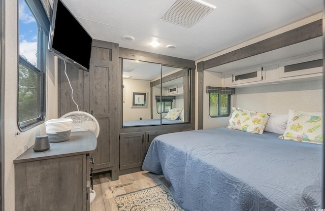 bedroom featuring a closet and light hardwood / wood-style floors