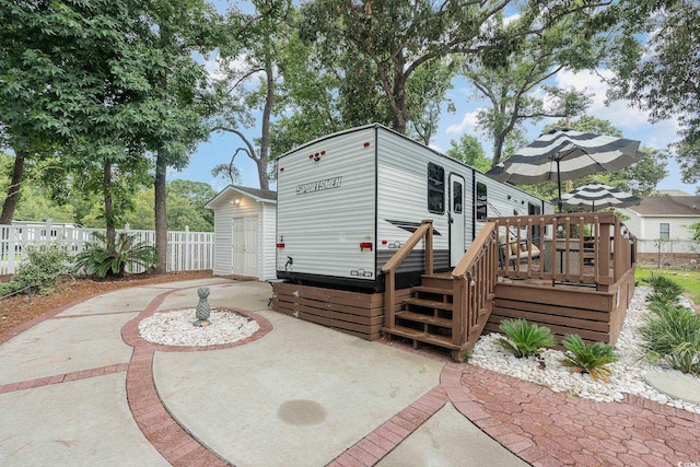 exterior space featuring a wooden deck