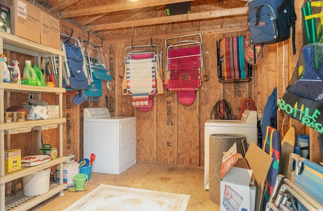 basement with washer / dryer and wood walls